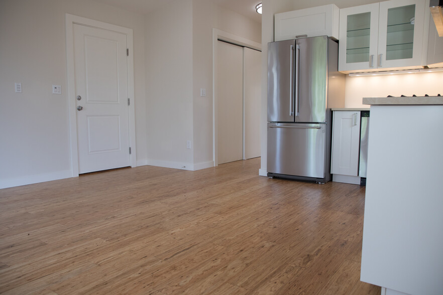 Off the main hallway lies the utility closet with additional storage and electric washer/dryer. - 5239 NE Mason St