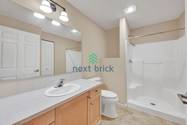 Building Photo - Rare Ground-Floor, End Unit with massive b...