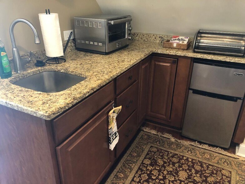 Kitchen detail with sink and disposal. - 5804 Searl Ter