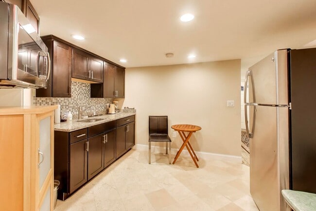 Building Photo - COMING SOON - Sprawling 5 Bed, 3 Bath, Two Kitchens, Dual Back Decks, Two Office/Den Townhouse, 2...