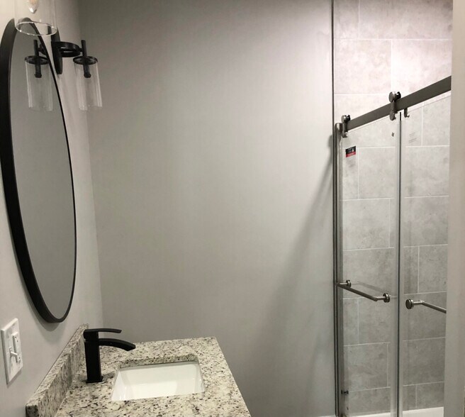 Unit one: bathroom with laundry space and in-unit, front-loading washer/dryer. - 34 Falcon St