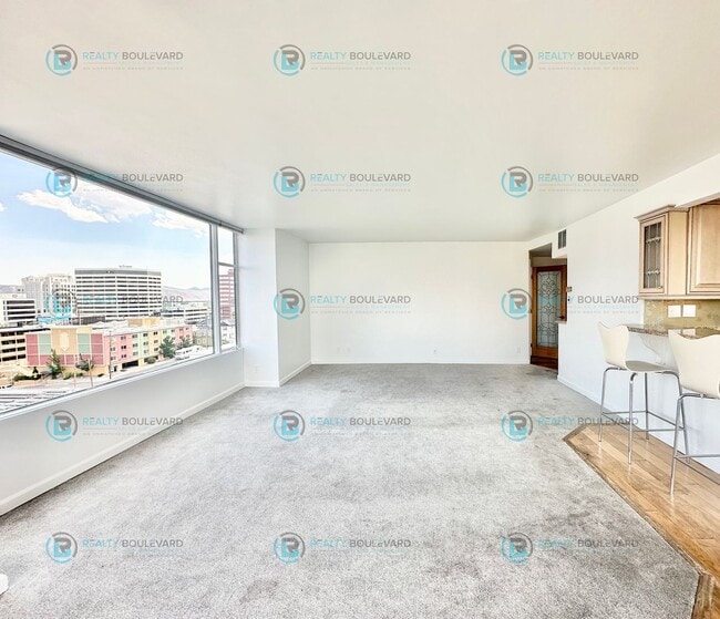Building Photo - Exquisite 1-bedroom, 2-bathroom condo Overlooking the beautiful Truckee River with covered parking!