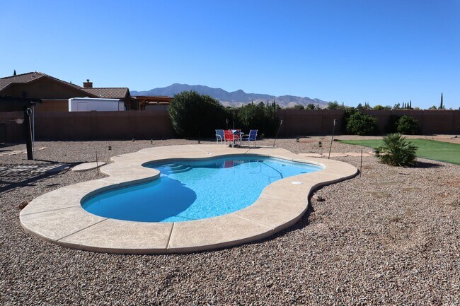 Building Photo - Home With A Pool and Much More!