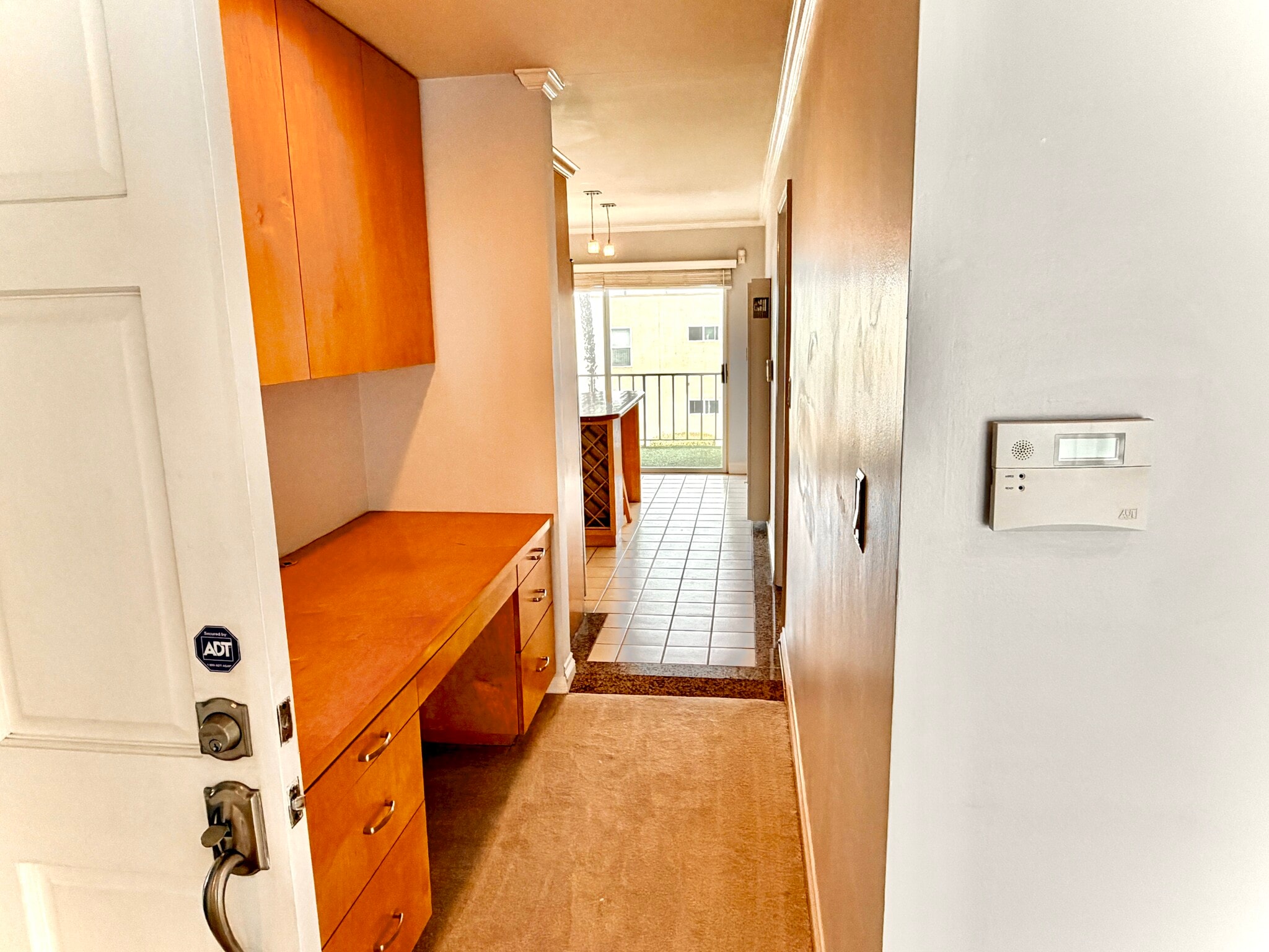 Another view of built in desk and cabinets leading to kitchen - 1649 Appian Way