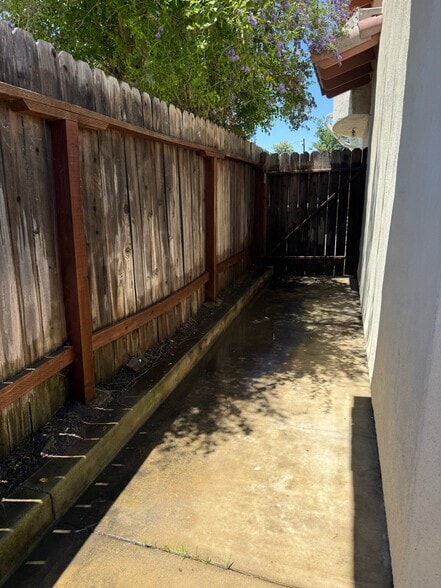 locked gate with convenient access to trash - 631 S Glassell St