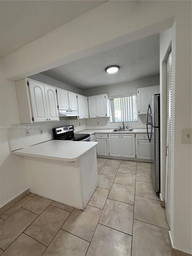 Building Photo - 7935 W 30th Ct