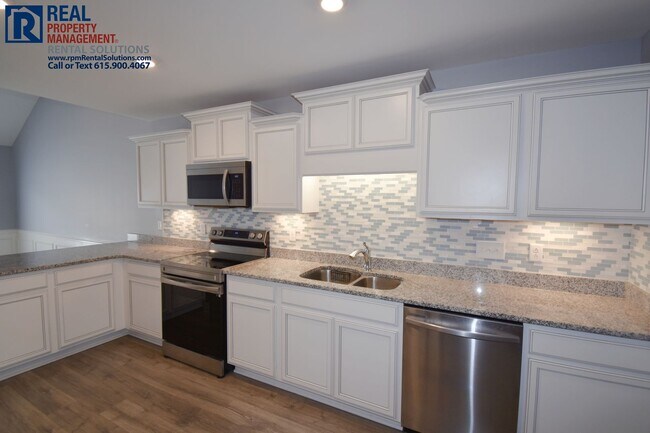 Building Photo - Gorgeous end unit 2 bedroom townhouse with garage! PLUS Loft!