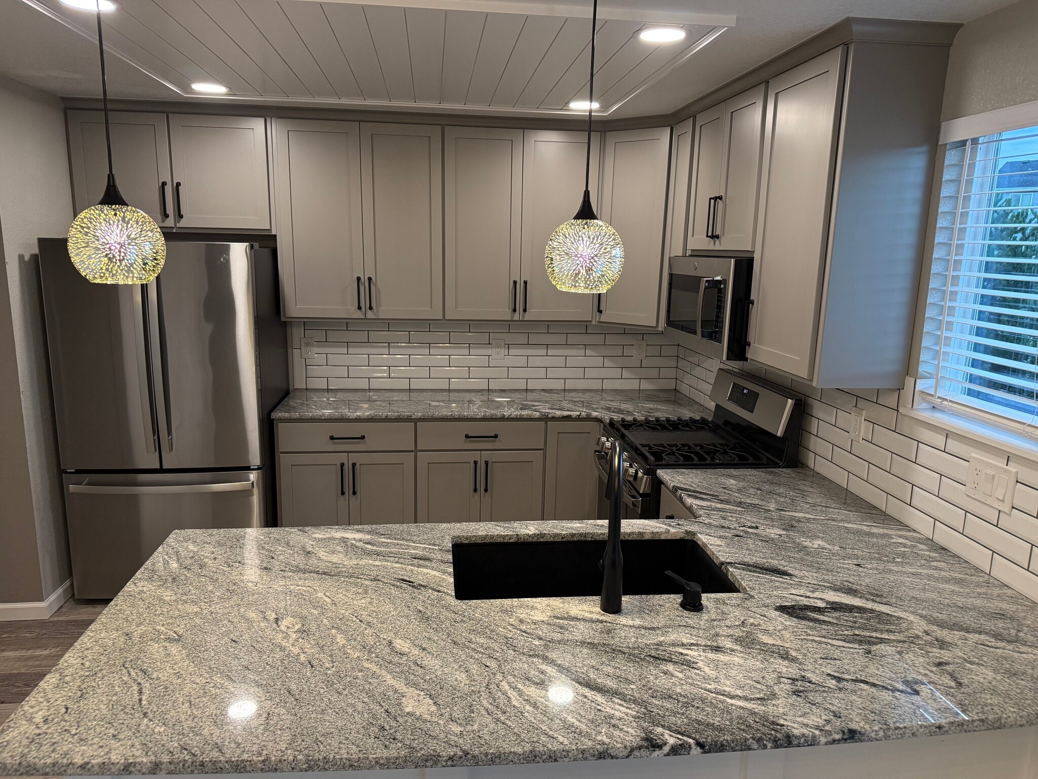 Kitchen with custom cabinets - 7153 Arrowroot Ave