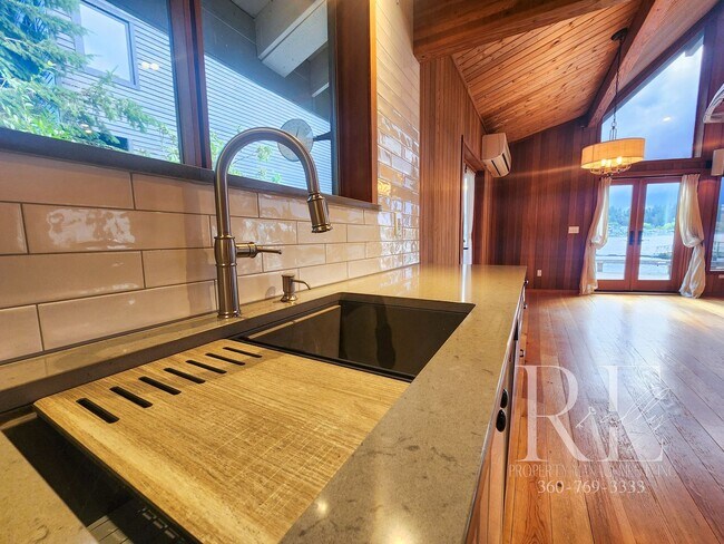 Building Photo - Waterfront Living in Indianola – Dock, Bea...