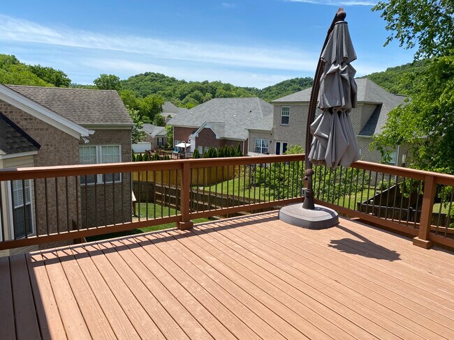 Deck with shade umbrella - 709 Warmstone Ct