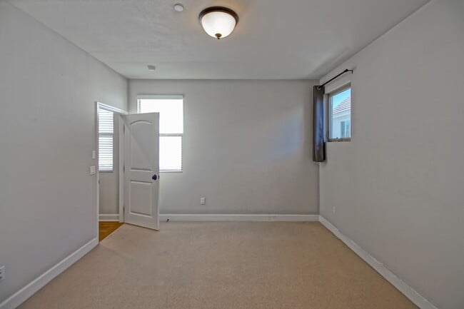 Building Photo - BUILT IN 2019: SPACIOUS & BRIGHT, DETACHED TOWNHOUSE W/ 2-CAR GARAGE & FENCED YARD IN GREAT RESID...