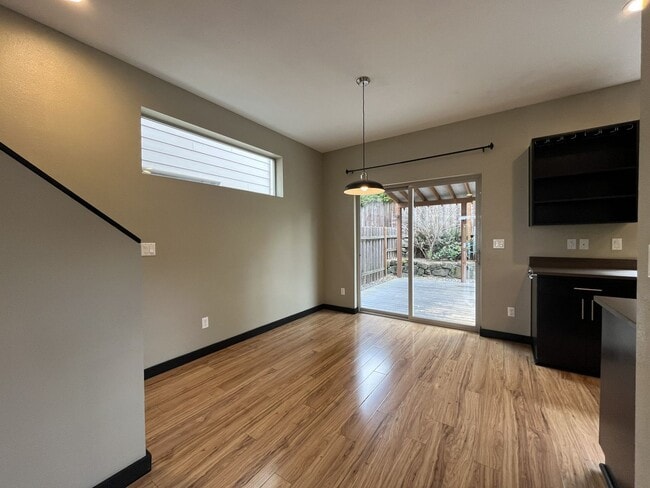 Building Photo - Charming 3 Bedroom, 2.5 Bathroom Home with Large Living Room, Tall Windows, Island Kitchen, and A...