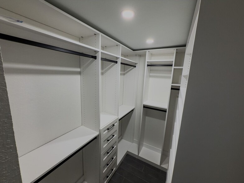 Main Large closet with shelving and hanging storage - 2006 Candle Ct