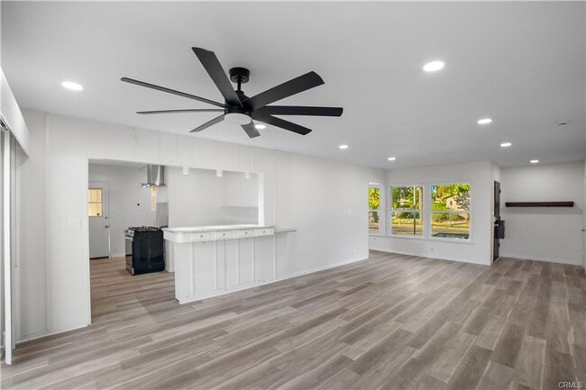 Building Photo - Welcome to this inviting 3 bedroom, 2 bath residence tucked away on a peaceful street in the hear...