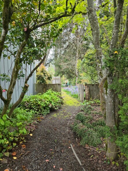 LANDSCAPED YARD WITH PATH FROM THE FRONT YARD - 5955 SW 179th Ave