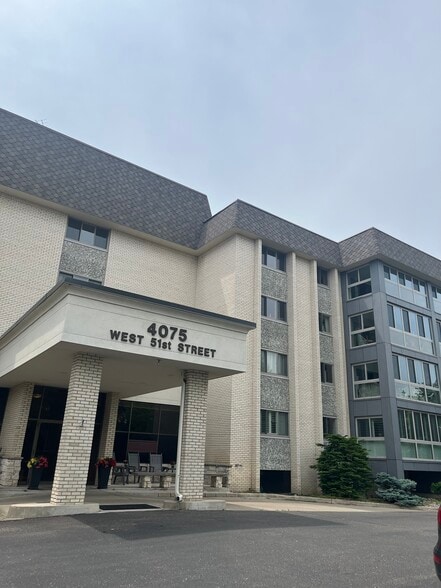 Building is solid concrete and has new porch facade - 4075 W 51st St