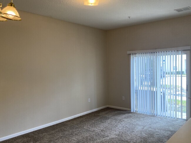 Building Photo - First-Floor 2BR/2BA Condo in Gated Nature’s Hideaway – Pool, Playground & Convenient Westside Loc...