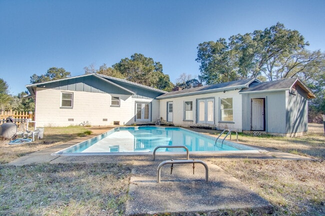 Building Photo - Stunning 4BR/2BA Pensacola Home with Private Pool, Modern Kitchen, Luxury Vinyl Flooring, Fully F...