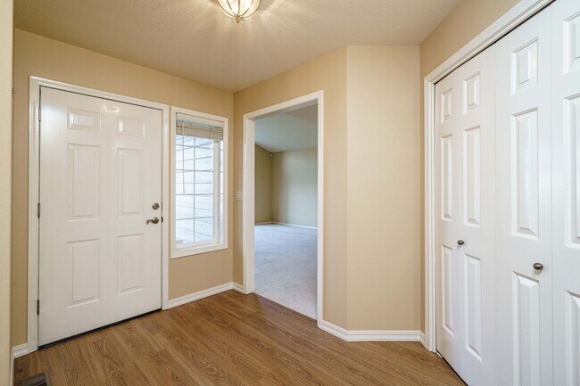 Building Photo - Beautifully Landscaped 1/4 acre with Well Maintained 4 bedroom 2 Bath Home with 3 Car Garage