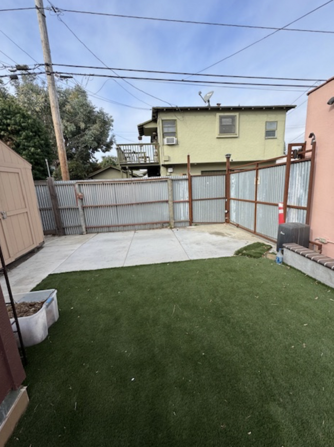 Open parking spot with electronic gate (single spot, uncovered). - 657 Euclid Ave