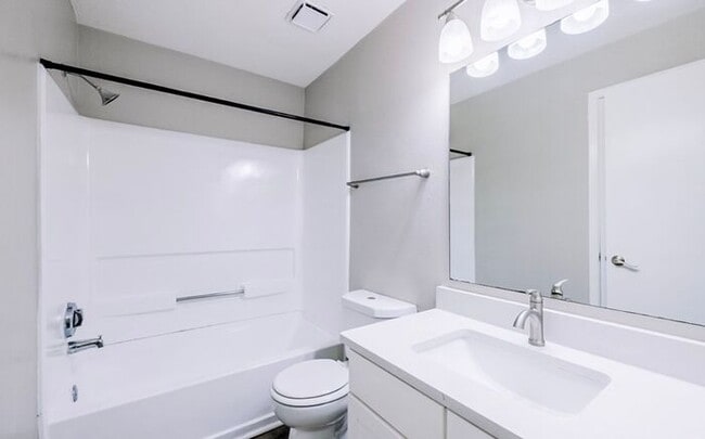 Building Photo - Spacious 2-Bedroom Elite Apartment with Private Balconies & Washer/Dryer