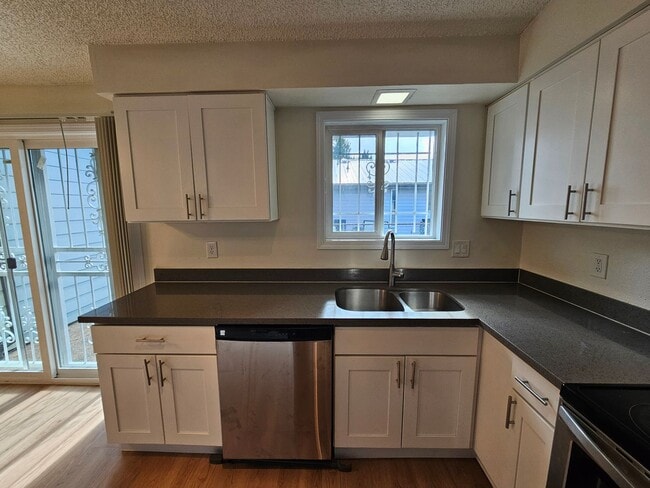 Building Photo - Charming Single-Level Home Featuring New Hardwood Floors, Bright Bedrooms & Open-Concept Living