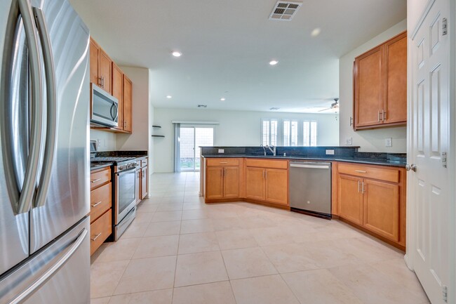 Building Photo - Green Valley!! Gated!! 4 Bedrooms!! Bed & Bath Downstairs!!  TANKLESS WATER HEATER!!! Covered pat...