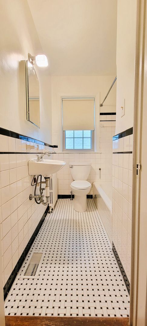 Building Photo - Remodeled brick bungalow with 1st floor li...