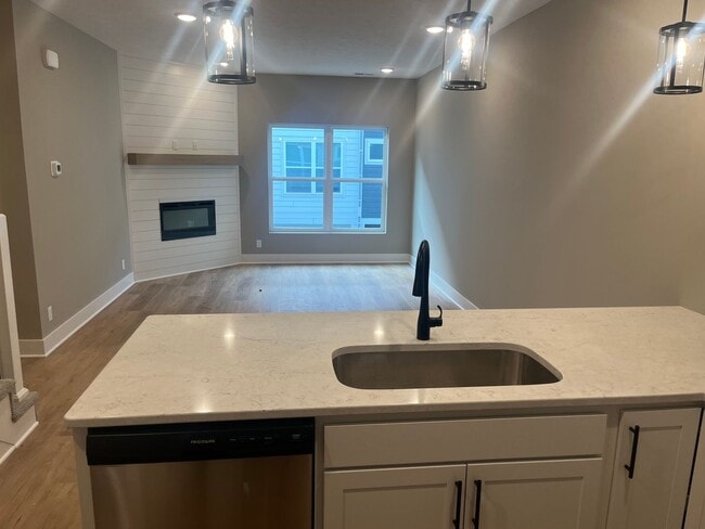 Building Photo - New Construction, 2 bed, 3 bath Row Home, with 2 car garage, fireplace, and rooftop deck!