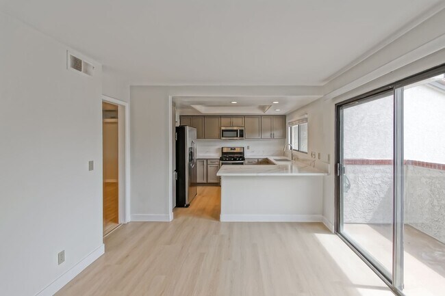 Building Photo - PRIME POOLFRONT LOCATION & CLOSE TO MAIN GATE! BRIGHT & SPACIOUS, END-UNIT POOLFRONT TOWNHOUSE W/...
