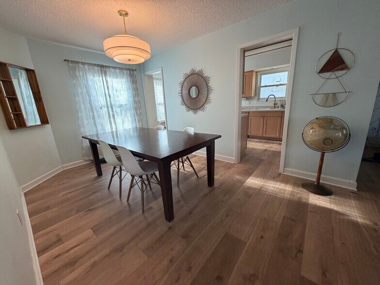 Dining room showing new hardwood floors. - 11700 Sweetwater Trl