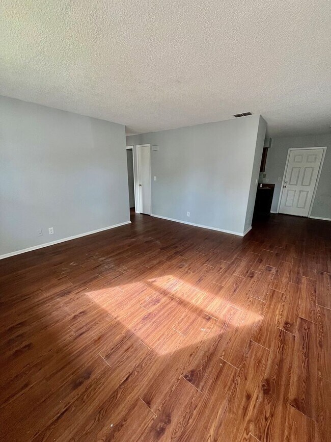 Building Photo - SPACIOUS 3BR/1.5BA w/Carport, Beautiful Wood Finish Flooring, Privacy Fenced Backyard! NO APP FEE!