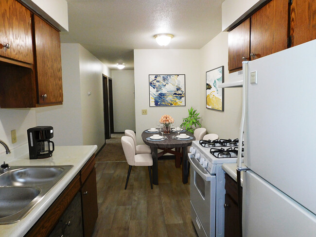 Kitchen with Double Sink and Refrigerator - West Broadway Apartments