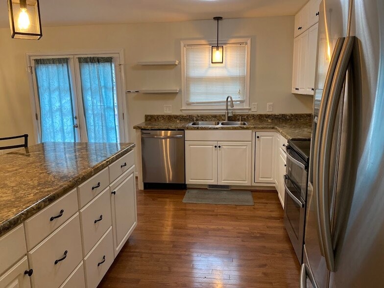 kitchen with dishwasher and double sink - 3705 Pfost Ave