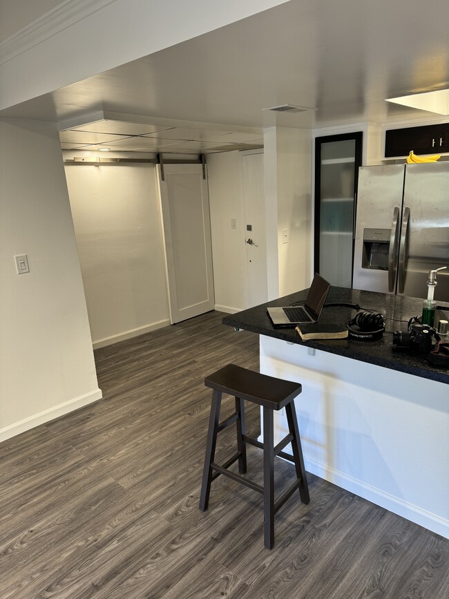 Living Room looking at Laundry Barn Door - 2700 Cahuenga Blvd E