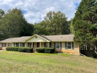 Building Photo - 4/2 brick ranch home with unfinished full ...