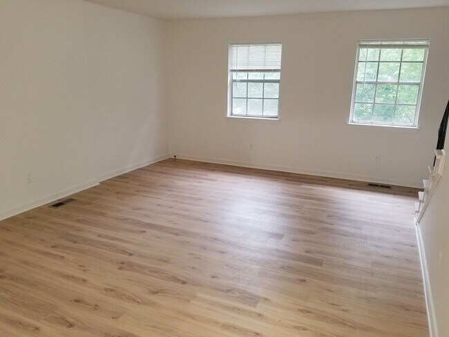 Building Photo - A spacious 3-Bedroom 1.5-Bathroom 3 Story Townhouse off of Old Forest Road With a Pool