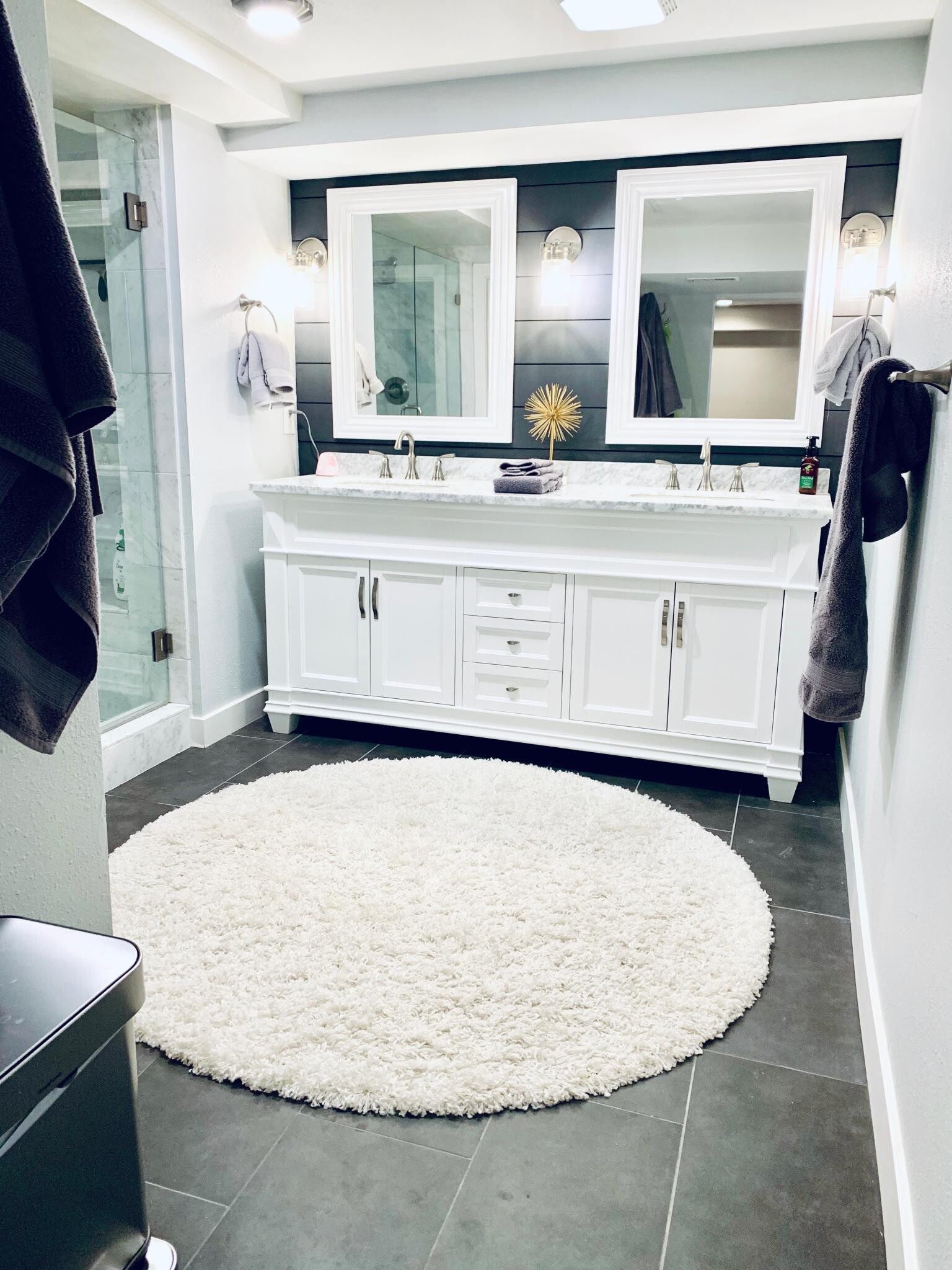Brand new downstairs bathroom featuring a marble shower, separate water closet, dual vanity, laundry - 1447 Osceola St
