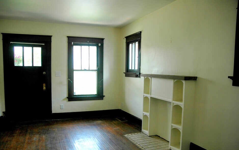 Livingroom with cute faux fireplace bookcase. - 5423 Rolston Ave