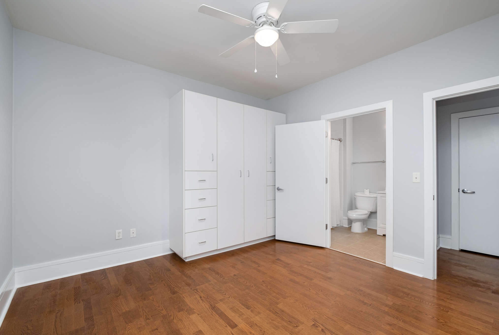 2nd bedroom with a look at the large built-in armoire and the 2nd bathroom - 1600 Fulton Ave