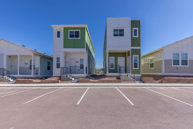 Explore these stylish duplexes that boast modern design and ample parking. - Cottages at Mesa Ridge