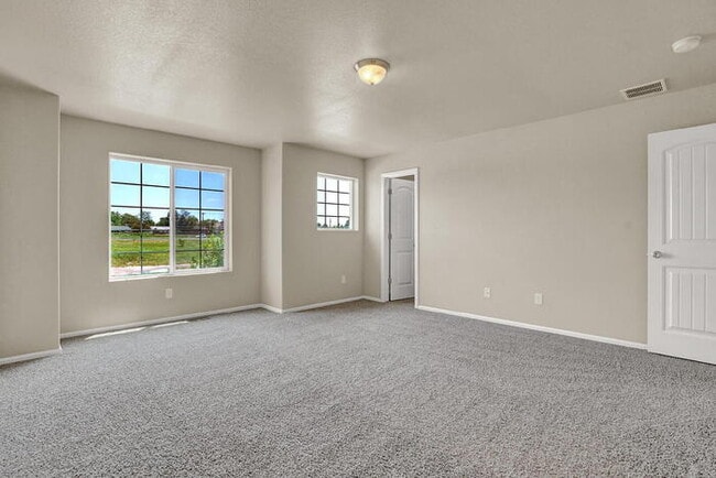 Building Photo - Modern Townhome with Central A/C, 2-Car Ga...