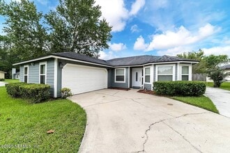 Building Photo - 7119 Swamp Flower Dr N