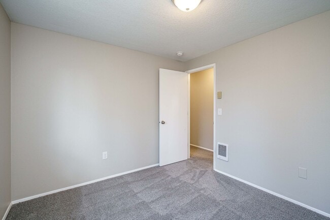Building Photo - Recently Updated with Wood Laminate Flooring and Fresh Paint