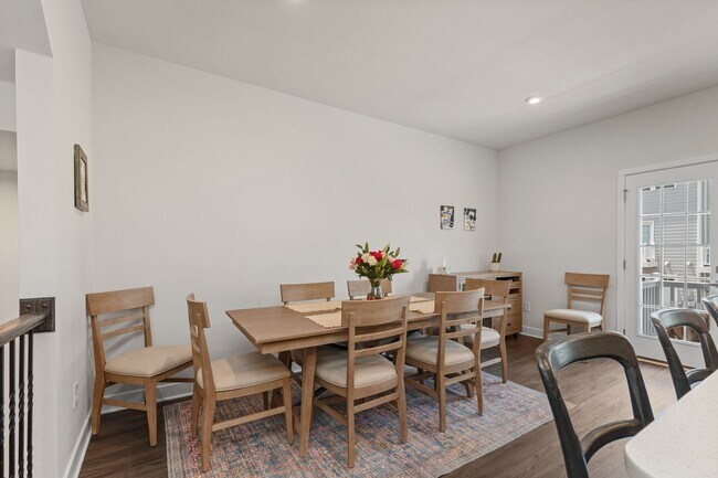 Building Photo - Luxurious three-story townhome with owner's suite and high-end finishes