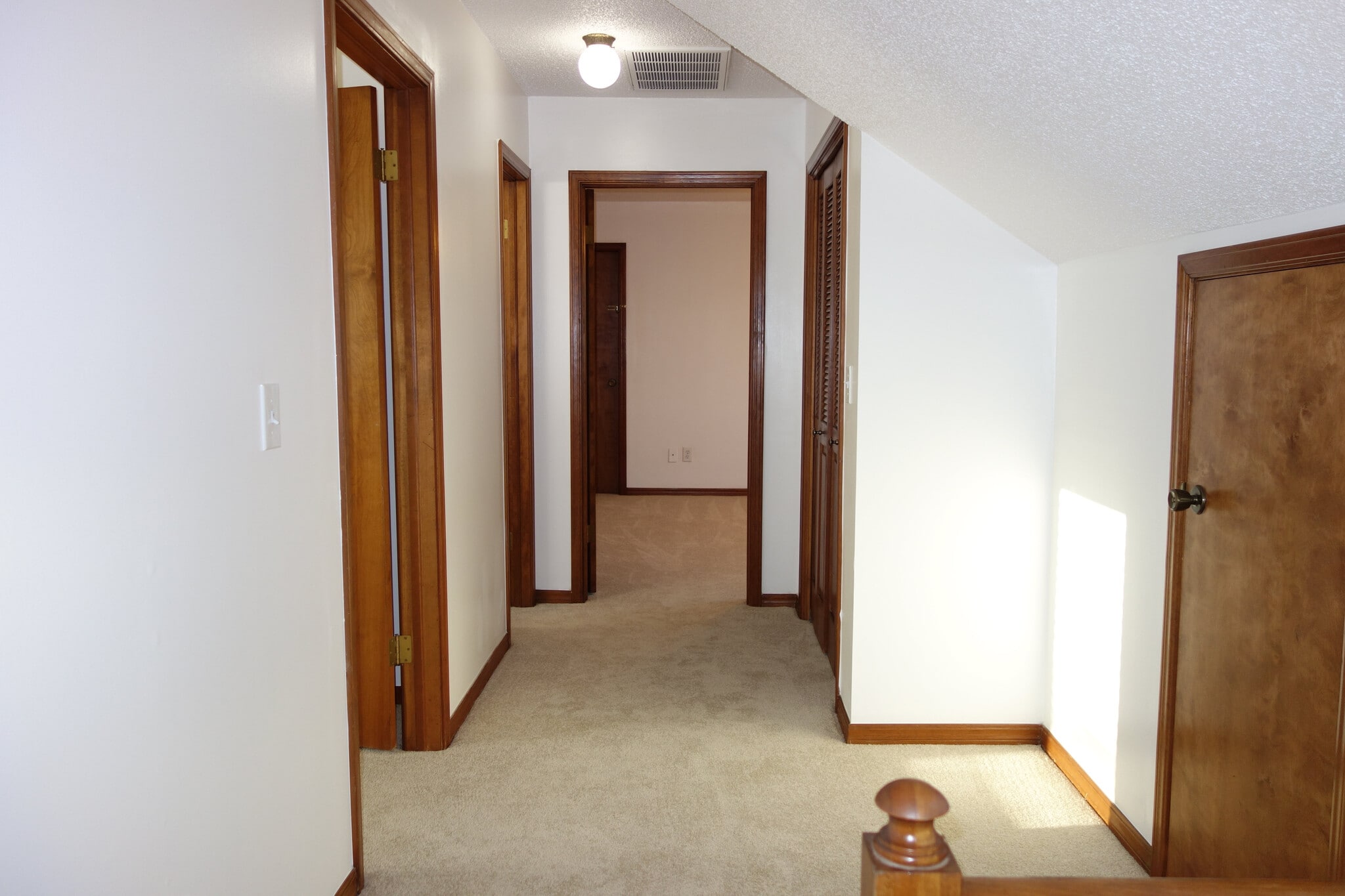 Stair Landing and hallway to Two bedrooms and one full bath - 7116 S Indianapolis Ave