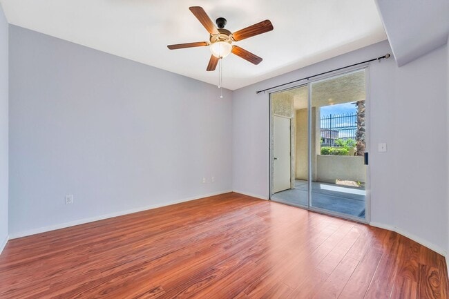 Building Photo - Modern Ground-Level Condo With A One Car Garage in Prime Southwest Location with Resort-Style Ame...