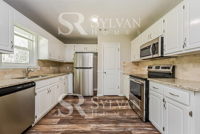 Building Photo - The living is easy in this 3 bedroom, 2 bathroom home