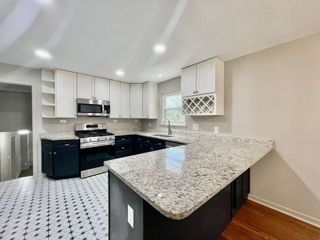 Building Photo - Updated Home w/ 2 Car Garage, Backyard and...