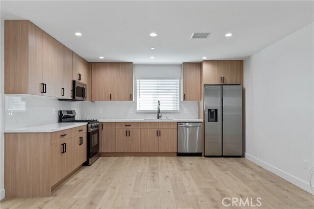 Building Photo - 11140 Woodley Ave